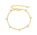 Lyssira Armband Edelstahl 18K vergoldet mit Goldkugeln, Freistellerbild mit Verschluss, detailreiche Produktaufnahme