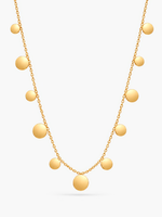 Goldene Lyra Plättchenkette von Mercy’s Jewelry mit runden Plättchen vor hellgrauem Hintergrund.