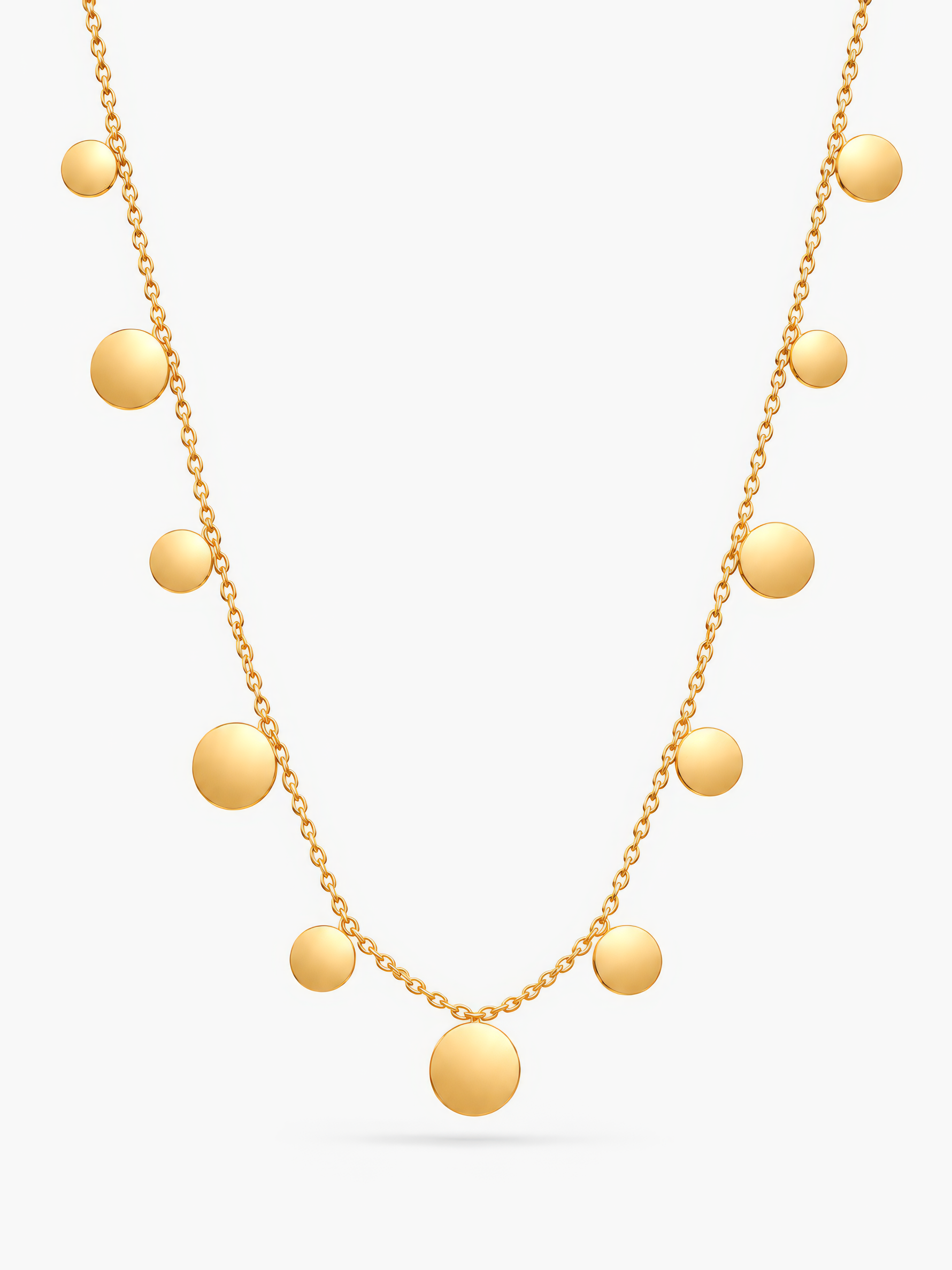 Goldene Lyra Plättchenkette von Mercy’s Jewelry mit runden Plättchen vor hellgrauem Hintergrund.